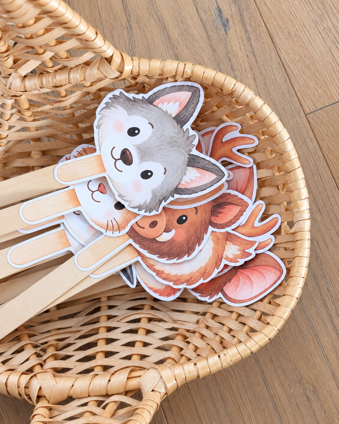 Animal heads on wooden sticks in a basket